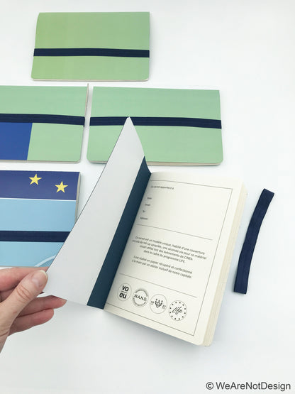 Carnet de note A5 avec pages ivoire vierges et fermeture élastique - upcycling évènementiel EU (matière de base: bâches de roll-up)